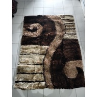 Shaggy brown round carpet 140x200