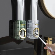 ที่แขวนแปรงสีฟันแปรงสีฟันขี้เกียจแบบบีบติดผนังอุปกรณ์ห้องน้ำเครื่องจ่ายยาสีฟันอัตโนมัติ