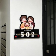 a family Motion Sensor Family House Number Plate | Custom Unit Number Signage with Cartoon Family De