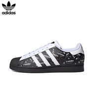 [กล่องต้นฉบับ] Adidas Original Superstar Logo รองเท้าผ้าใบกันลื่นสำหรับผู้ชายและผู้หญิงพิมพ์ลายเต็ม - สีขาวและสีดำ
