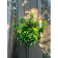 Fake trees, decorative plastic branches and leaves