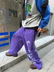 กางเกงขายาวทรงหลวมสไตล์อเมริกัน CGGA สำหรับผู้ชายและผู้หญิง ทรงหลวมสบาย ๆ พร้อมเชือกผูกเอวและพิมพ์ลา