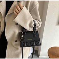 Small black crossbody bag that fits a phone