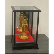 Statue .bucha . amulet. display case with back mirror.