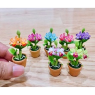 Miniature Clay Orchid In A Brown Pot Height 4.5 cm. :Piece