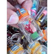 GANTUNGAN SHIP SOUVENIR KEYCHAIN IN A FLOWER BOTTLE IN A MINIATURE WOODEN PINOKIO BOTTLE