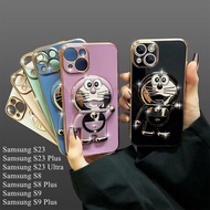 For Samsung Galaxy S23/Samsung S23 Plus/Samsung S23 Ultra/S8 Plus/S9 Plus Luxury Cartoon Doraemon Bracket Glitter Plating Camera Protection Phone Case Soft TPU Back Cover