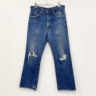 Used 90s Levi's 517 bootcut denim pants in indigo with orange tabs.