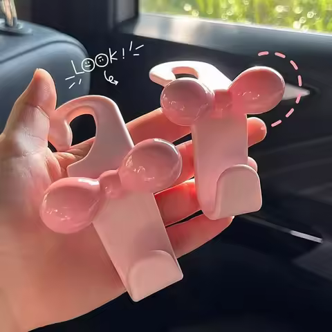 2 car hooks, bows, pink storage bags in the car, car hooks.