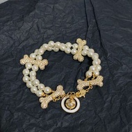 英國知名設計師品牌Vivienne Westwood土星水鑽狗骨頭雙層珍珠手鍊 代購服務