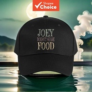A stylish black baseball cap featuring bold JOEY DOESN'T SHARE FOOD lettering, adjustable for both m