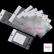 100 cái Túi kiếng trong dán miệng keo có lỗ treo Túi bóng kính nilon opp có miếng màng ngọc treo lên