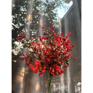 Fake trees, decorative plastic branches and leaves