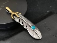 Mens Womens Stainless Steel Goros Takahashi Gold Eagle Claw Feather Pendant With Blue Stone.