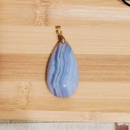 Blue lace agate cabochon specimens in display box