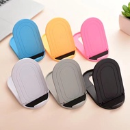 Oval multi angle desktop stand for mobile phones and mini tablets