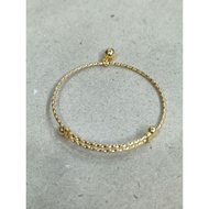 2 gram young gold cross-wrapped baby bracelet