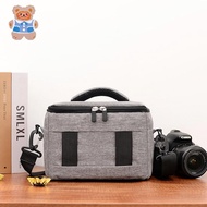 DSLR camera camera bag including carrying handle shoulder strap DSLR camera/lens compartment storage