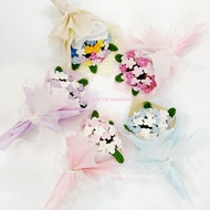 Bouquet of multi-colored hand-crocheted wool forget-me-nots
