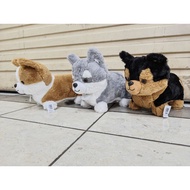 Cute dog doll made of fur. Cute dog character doll.