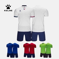 KELME ชุดชุดฟุตบอลแท้สำหรับสำหรับทั้งหญิงและชายเสื้อเจอร์ซีย์ทีมแขนสั้นชุดฝึกซ้อมการแข่งขันของนักเรียน