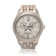 Patek Philippe Reference 5036/1G, a white gold automatic annual calendar wristwatch with white ceramic dial, moon phases and bracelet, Circa 2000