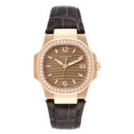 Patek Philippe Patek Philippe Nautilus (Reference 7010R-012). A rose gold diamond-set quartz wristwatch with date.
