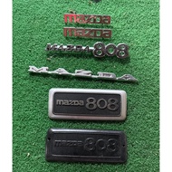 Emblem fender & trunk lid, mazda 808. New old stock brand