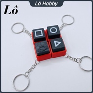 Squid game stress-relieving clicky keychain - Squid game