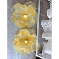 Giant flower [Giant yellow flower head spreads as pictured]