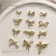 (JJ) 10pcs nail charm Ribbon GOLD alloy GANJIL 12 models