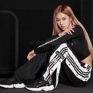 ADIDAS ORIGINALS 情侶款男女同款雙排扣開叉運動褲衛褲 潮流長褲