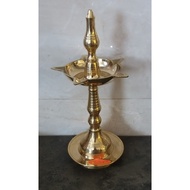 Jyotir action lamp on Indian prayer altar