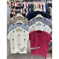 Women's short-sleeved round neck sweater with many black bows made in Guangzhou, form-fitting autumn
