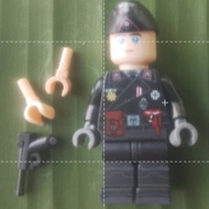 WW 2 German in black uniform with 2 gloves and standee plate.(Plastic toy and less than 2 inches)