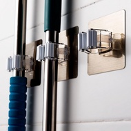 Wall-mounted mop hanger holds brooms and toilet brushes with good strength. Lusen P1 Lusen