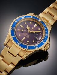 Rolex Reference 1680 Submariner | A yellow gold automatic wristwatch with date, bracelet and tropica
