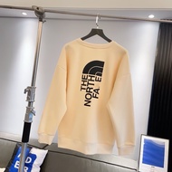 NORTH FACE รุ่น Beijia ฤดูใบไม้ร่วงฤดูหนาวเสื้อกันหนาว จำกัด คู่รักหลวมแขนยาวรอบคอลำลองด้านบนพิมพ์ให