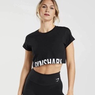 GYMSHARK การออกกำลังกายโยคะคร็อปเสื้อกล้ามแบบหลวมพอดียิมสำหรับผู้หญิงแขนสั้นวิ่ง