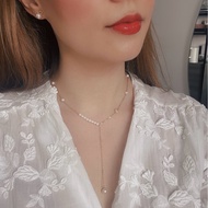 “FANCY” pearl necklace with four-petal flower charm and falling Akoya Pearly Dolly pearls