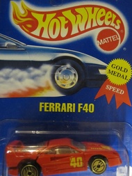 Ferrari F40 Hot Wheels 1994 Gold Medal Speed #69 Red with Golden Ultra Hot Wheels on Solid Blue Card