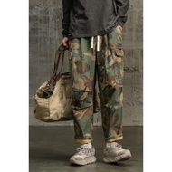อินเทรนด์สไตล์ฮ่องกงกางเกงผู้ชายหลวม Fit ขาตรงหลายกระเป๋าแฟชั่นเยาวชนฤดูใบไม้ร่วงหนา Harem Casual Lo