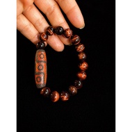 Tibetan 9-eye dzi bracelet - red brown tiger eye stone