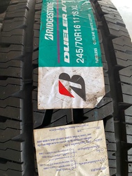 245/70R16 BRIDGESTONE AT 001 🇹🇭 ยางใหม่ ผลิตปี 2024  ตัวหนังสือขาว ชอบลุย ทนทาน รถโดดเด่นขึ้น นุ่มเง