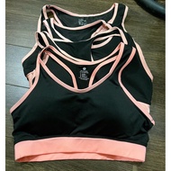2h. black sports bra with orange trim M. 145