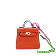 Hermès Terre Battue Tadelakt Micro Mini Kelly Twilly Charm Gold Hardware, 2022