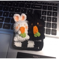 White rabbit and black rabbit wool keychain holding carrots (Rabbit wool shop)