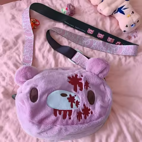 Gloomy Bear plush crossbody bag: Pink, cute - edgy with “blood - splatter” details. A fun, unique pi