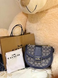 “Coach Alie Saddle Bag in Signature Jacquard / Midnight Navy leather (style C3464)”.