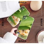 Very chill iphone Phone Case in the shape of a yellow duck in the rain under a green foliage 14 pro 